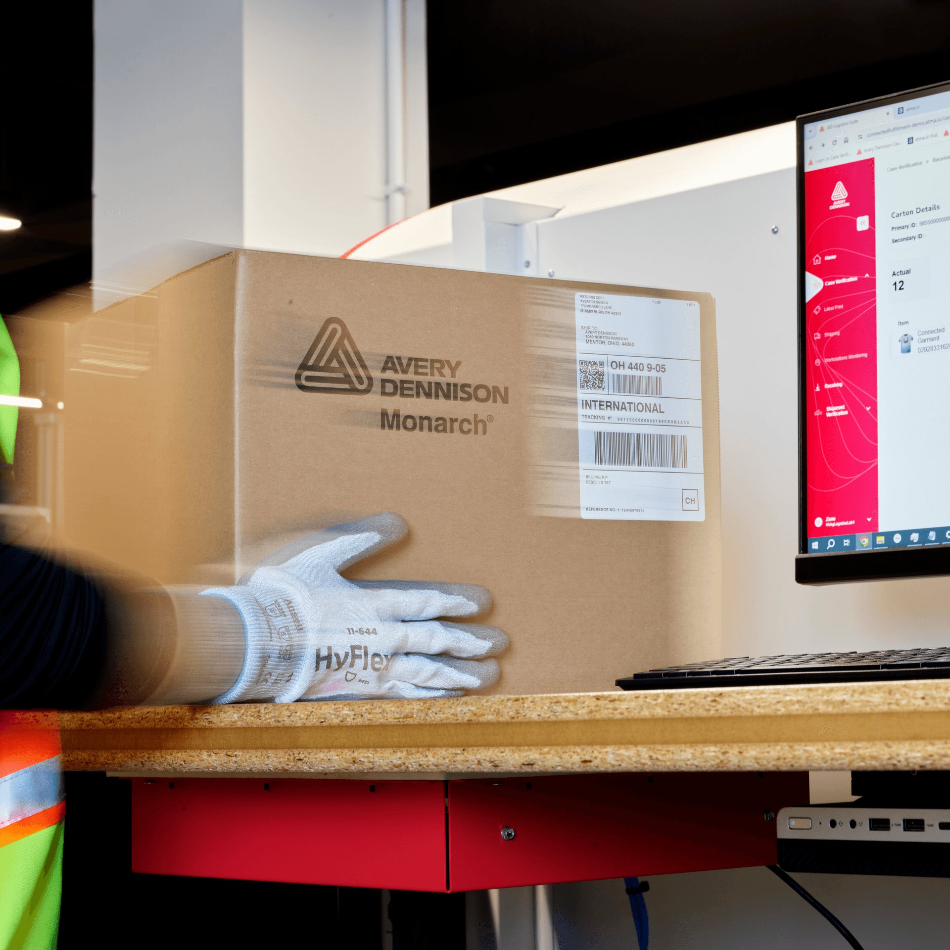 hand held scanner scanning a barcode on a package