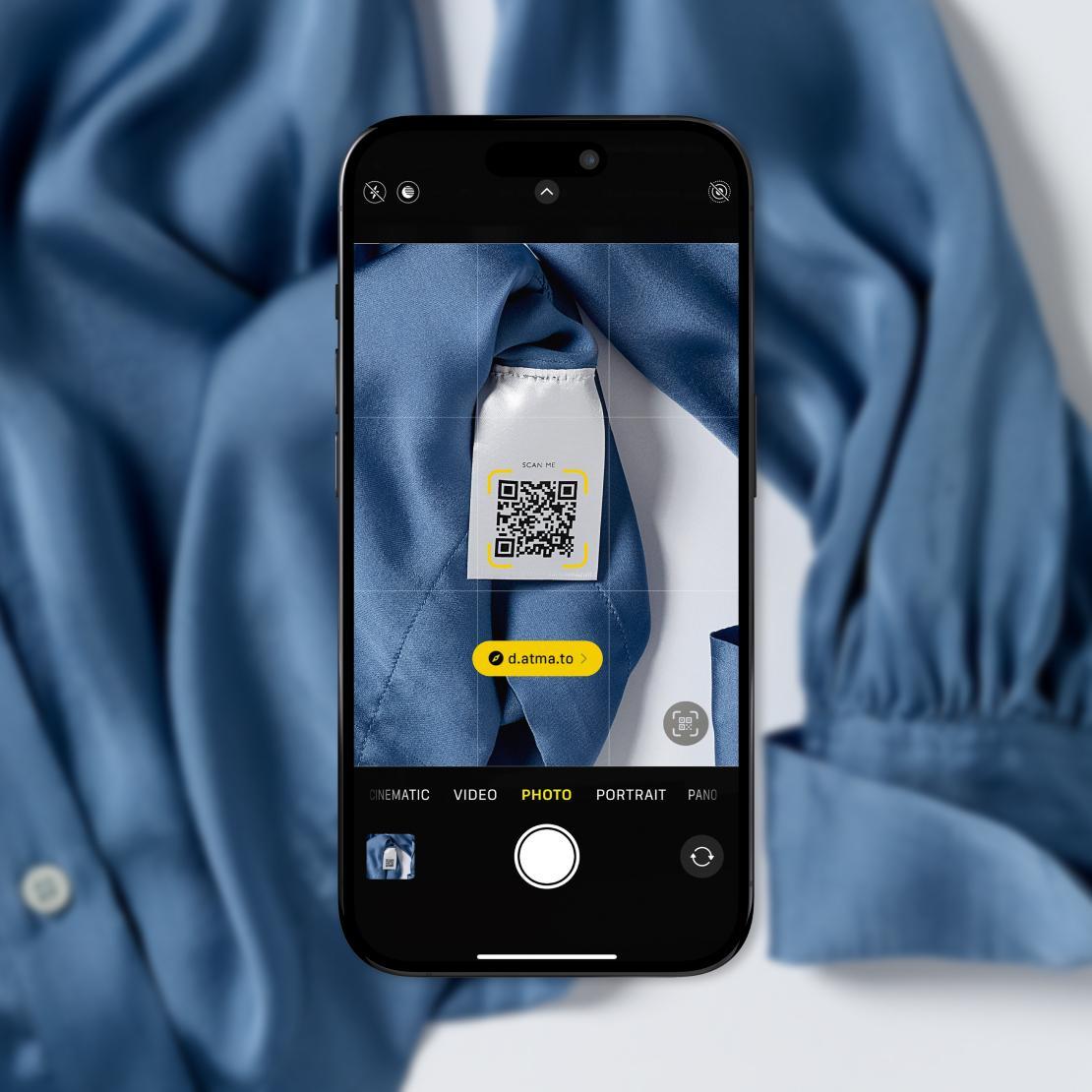 phone scanning  a QR digital trigger leading to atma.io connected product cloud