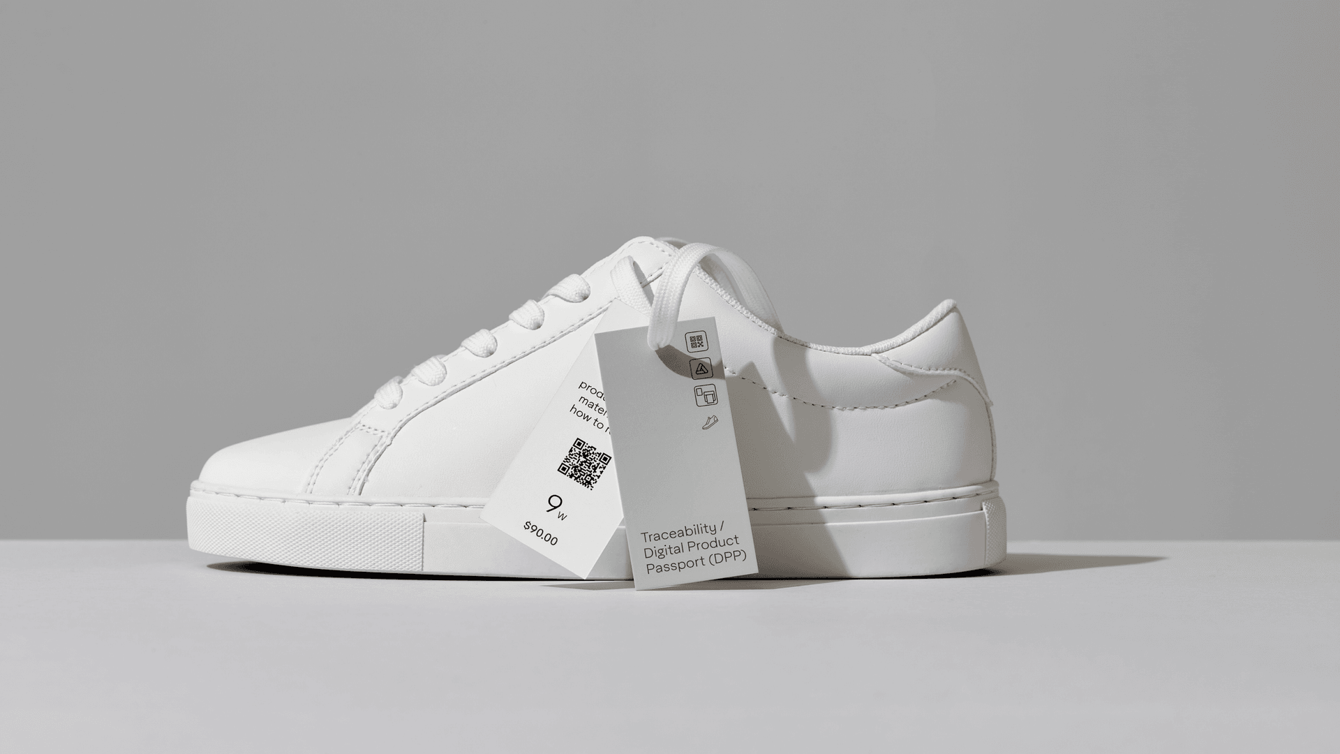 side view of sneaker featuring sustainable hang tags on shoe lace