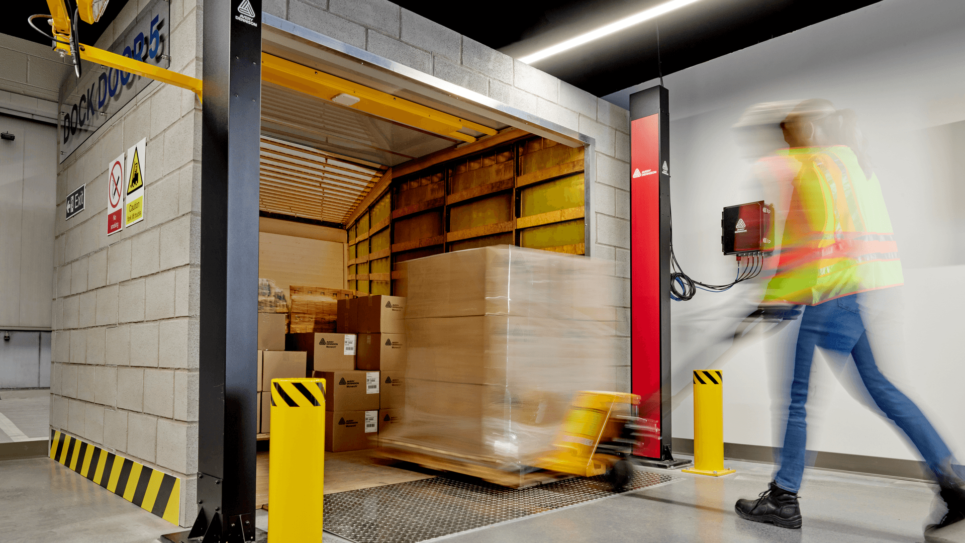 forklifts in large warehouse full of boxes